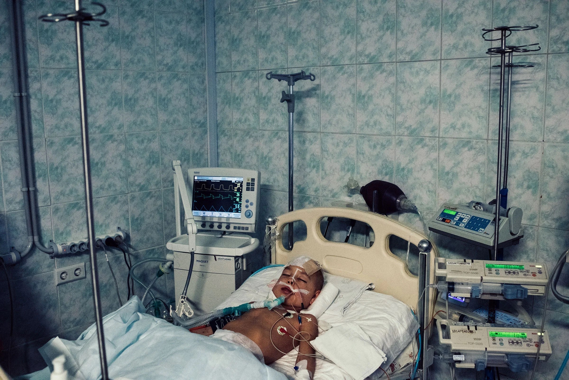 The first patient to arrive at the main children’s hospital in Kyiv after the Russian invasion was a young boy named Semyon, photographed on Feb. 28. His family’s car had come under heavy fire, killing his parents and his sister. The boy later died.
