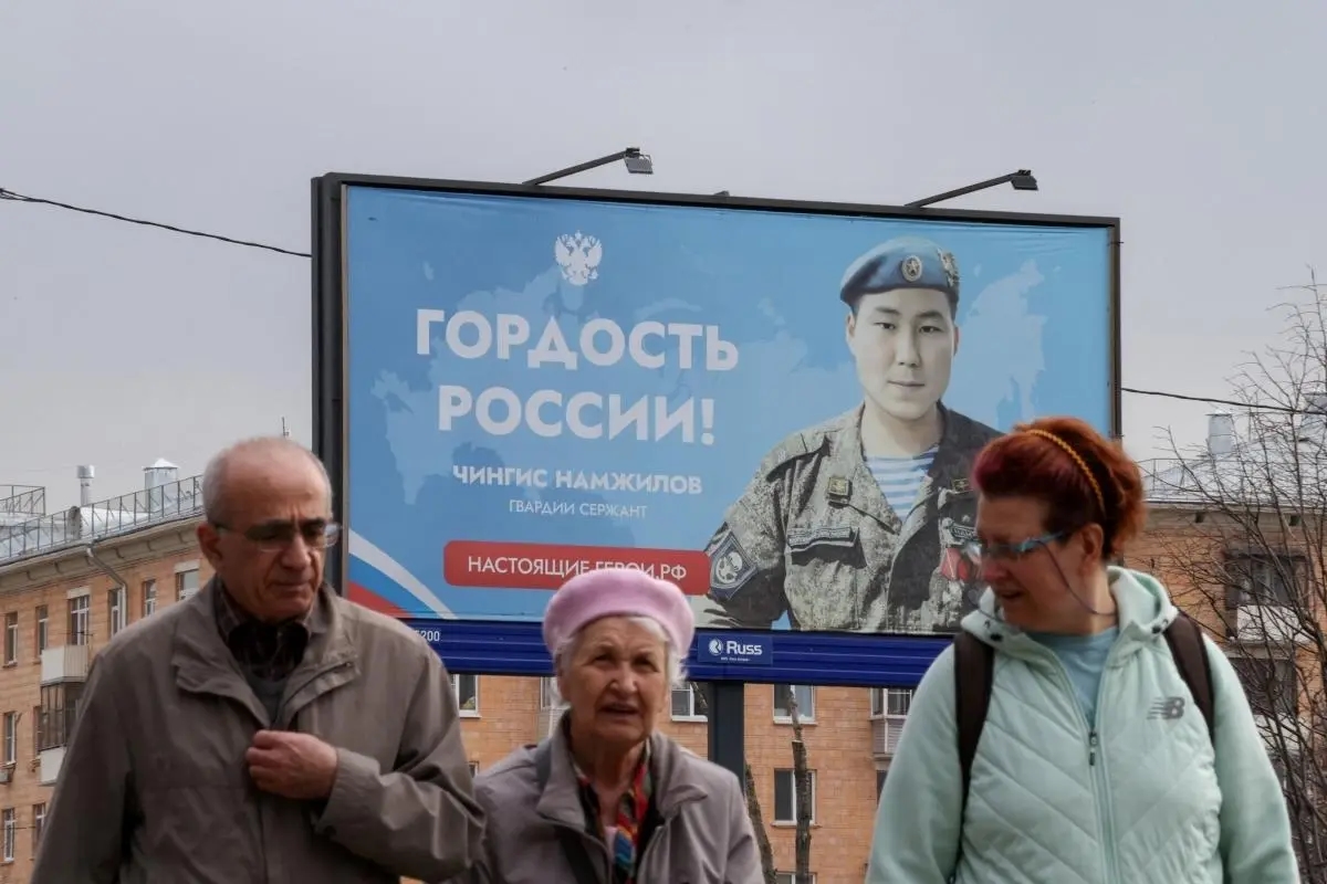 A billboard featuring sergeant Chinis Mamzhilov reading "The pride of Russia." Photo: Ramil Sitdikov / Reuters