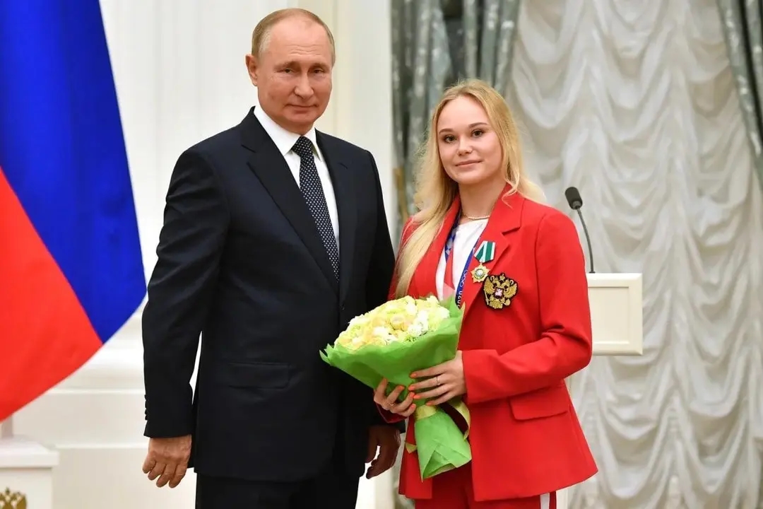 Angelina Melnikova with Vladimir Putin. Photo: RIA Novosti