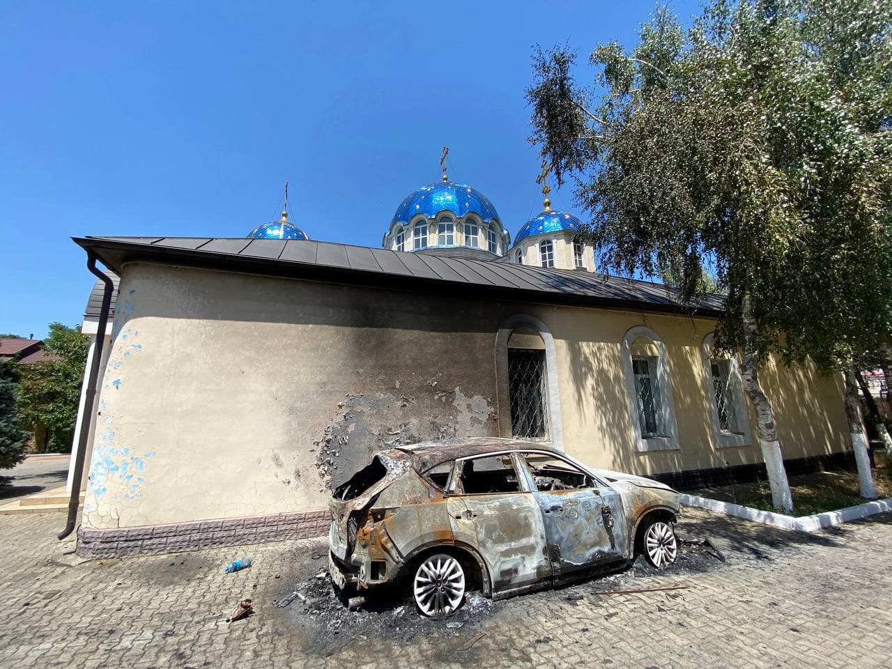 The Holy Dormition Cathedral in Makhachkala. The building is intact, except for a few smashed windows and bullet halls in the walls