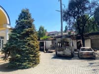 Burnt-out cars in the cathedral yard