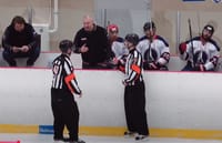 Igor Musatov coaches a hockey game
