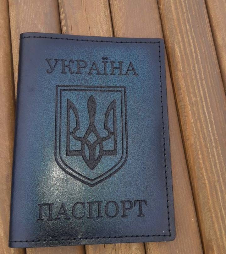 Omsk resident beaten by police and fined by court for displaying passport cover with Ukrainian coat of arms