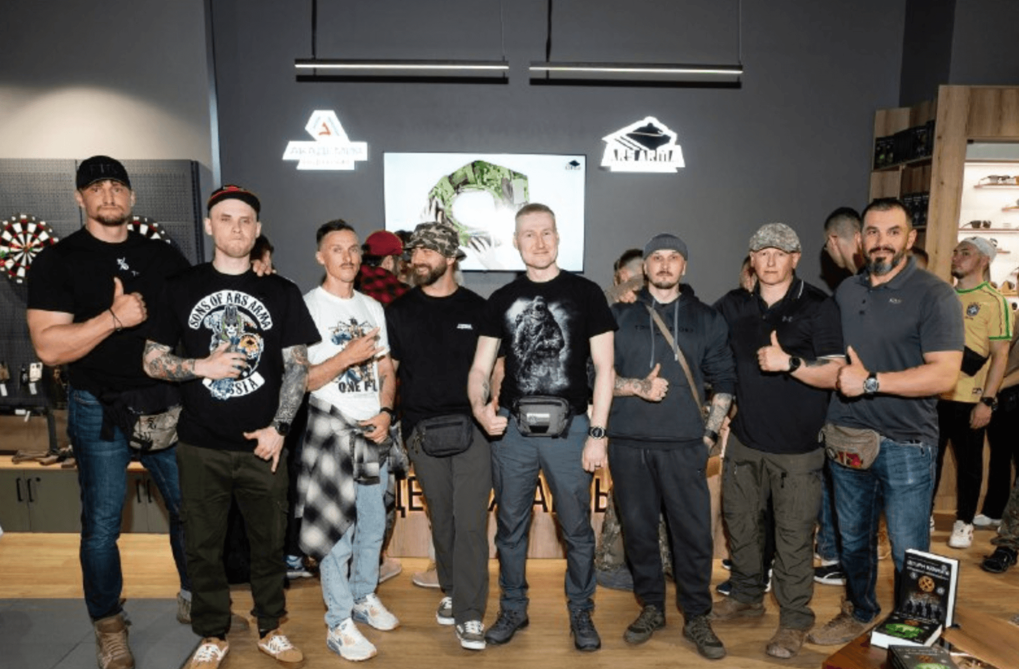 Grizdak is on the far right, beside Russian milblogger Razvedos, posted May 19, 2026