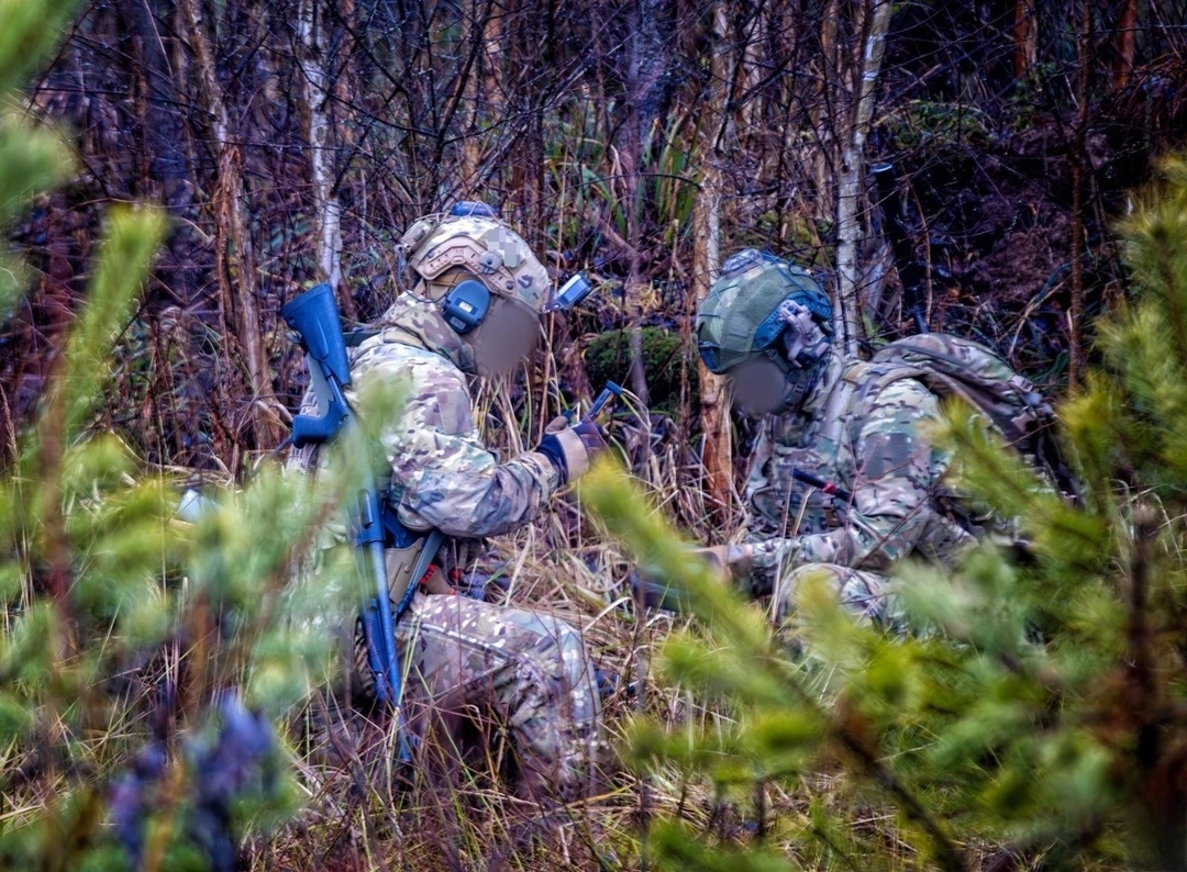 Participants in a military tactical shooting competition with Benelli M4 shotguns