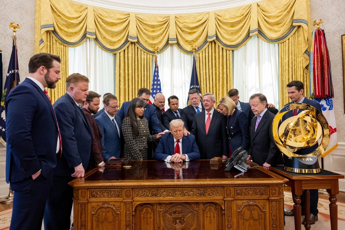 Pastors pray for Trump and alongside him in the Oval Office of the White House in Washington, D.C.