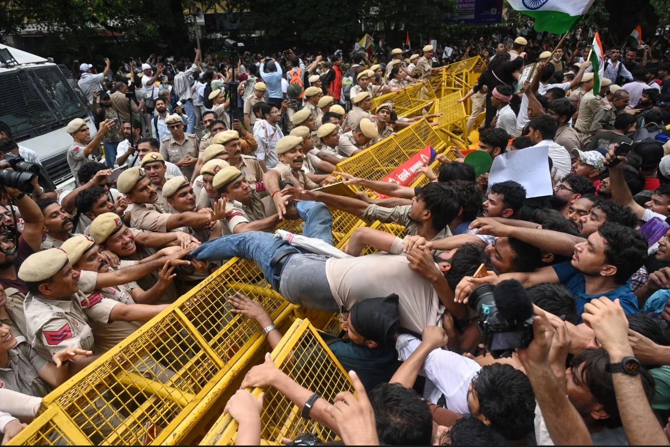 Supporters of the Cockroach Janta Party clash with police as they try to reach parliament. New Delhi, July 20, 2026