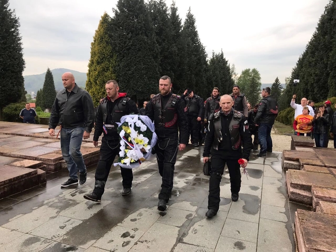 Denis Nalyotov, second from left, and Alexander Sautner, third from left, during a wreath-laying ceremony by members of the Night Wolves motorcycle club