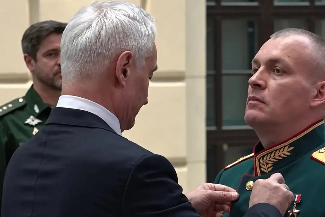 Russian Major General Anton Grunis receives the Gold Star medal of the Hero of Russia from Defense Minister Andrei Belousov during an Aug. 27, 2026, award ceremony. Screenshot: TASS