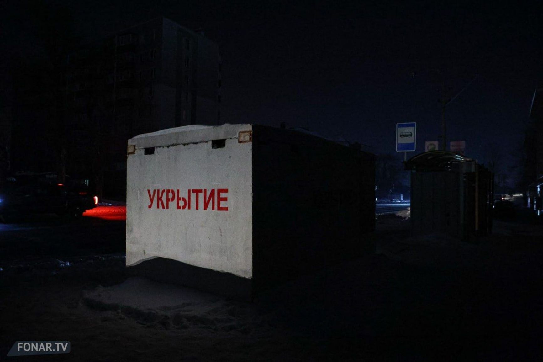 A concrete bomb shelter in Belgorod next to a public transport stop, pictured during a blackout