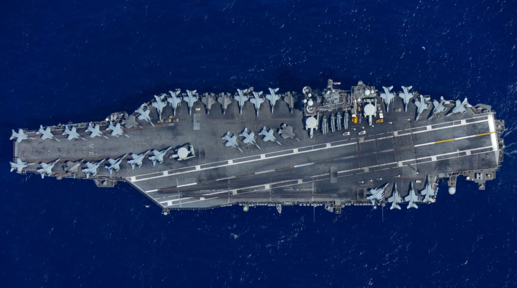 A top view of the American aircraft carrier USS Abraham Lincoln (CVN-72), July 28, 2022