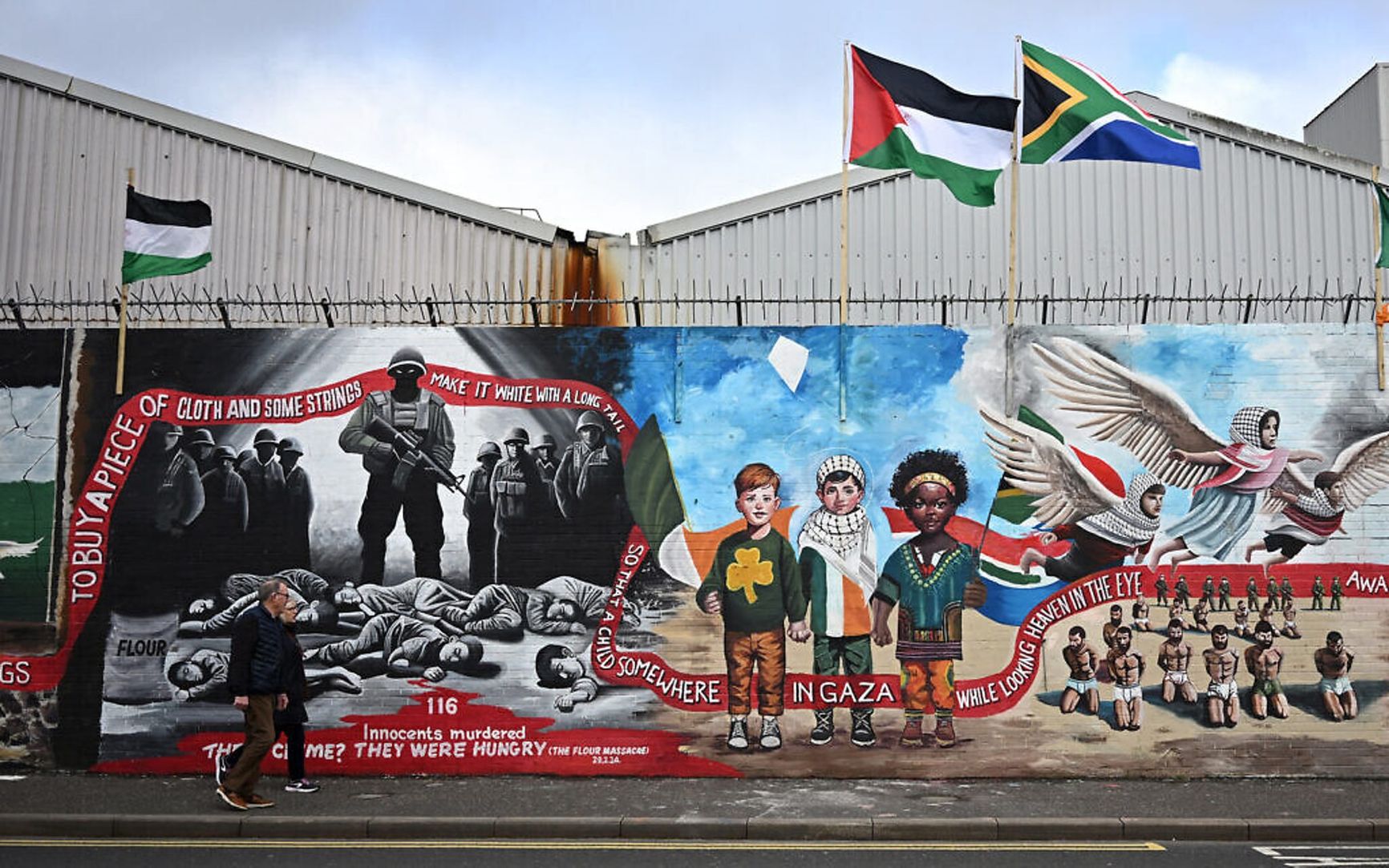 A mural in Belfast depicts Israeli soldiers as dark and somber figures against a backdrop of slaughtered children in Gaza. May 2024