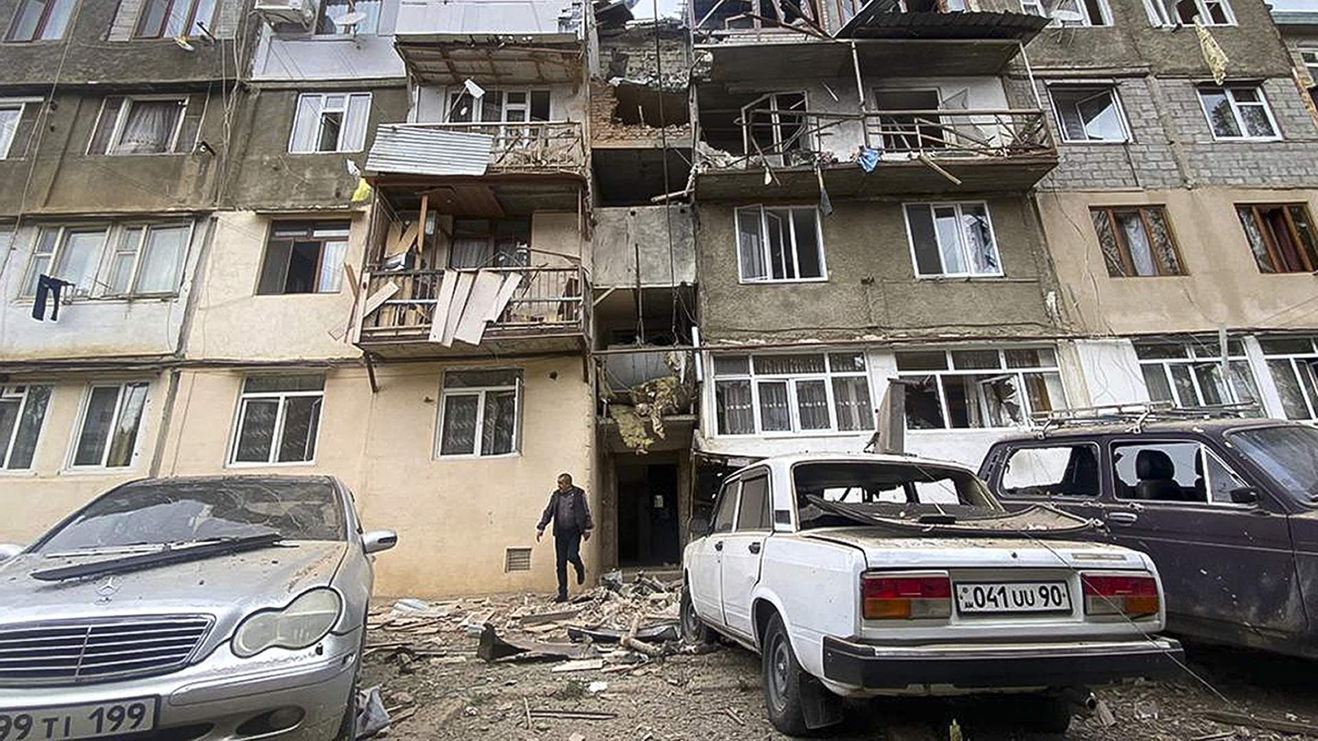 A view of a damaged apartment building and cars after the start of a military operation by Azerbaijani armed forces in the ethnic Armenian town of Stepanakert in Nagorno-Karabakh, September 19, 2023.