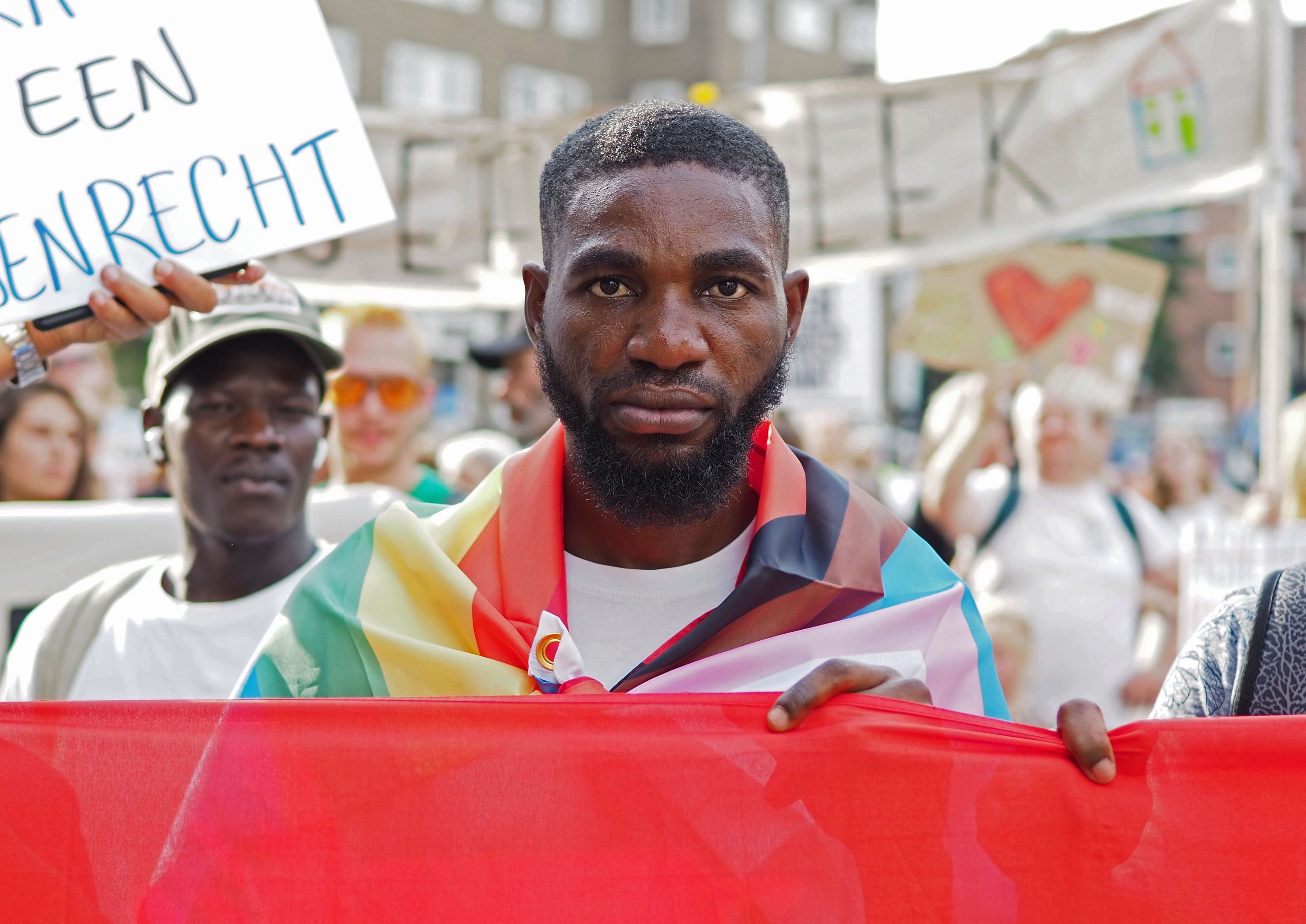 Bright, a refugee from Nigeria, protests conditions for asylum seekers, September 2022