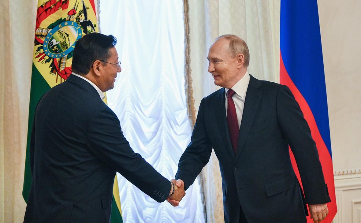 Morales’s fellow party member and rival, Luis Arce, at a meeting with Putin