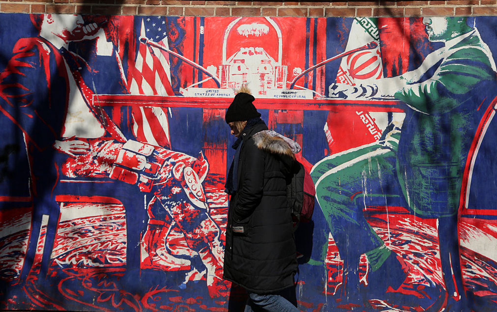 A mural depicting talks between U.S. and Iranian representatives on the wall of the former U.S. embassy in Tehran