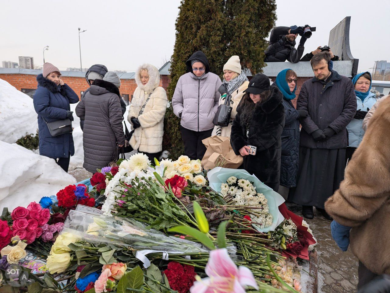 Dozens of people, including Navalny’s mother and mother-in-law — Lyudmila Navalnaya and Alla Abrosimova — came to his grave to pay their respects on the second anniversary of his death.