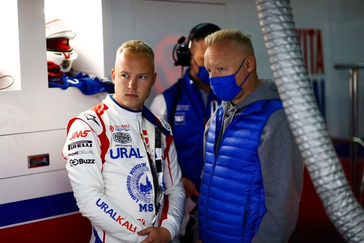 Then-Formula 1 driver Nikita Mazepin pictured alongside his father, Uralkali CEO Dmitry Mazepin, in the garage of the Haas F1 team in 2021