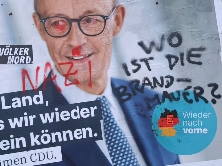 CDU election poster covered in graffiti. Photo: Sean Gallup / Getty Images