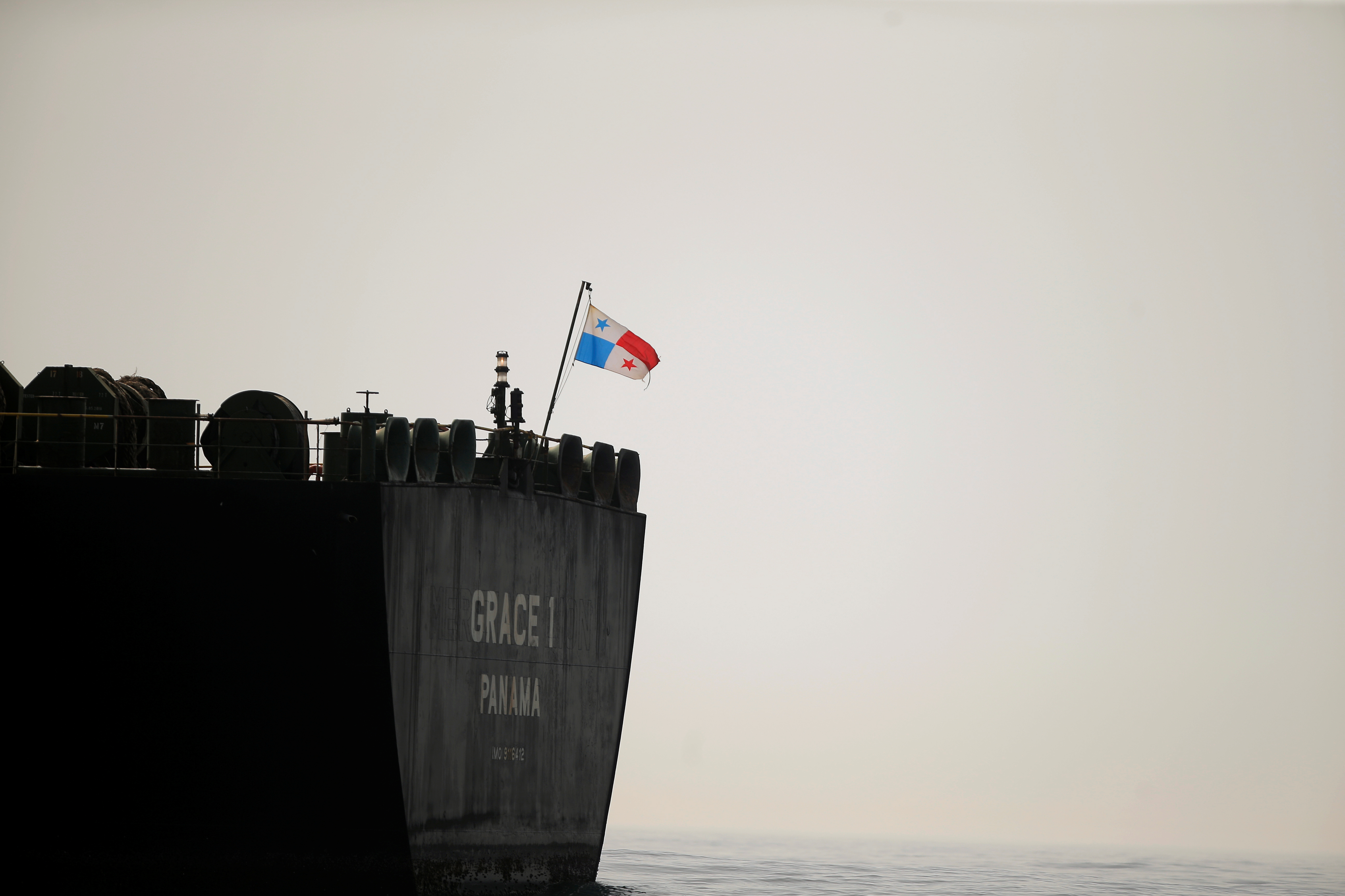Panama's flag flies on the stern of the Iranian oil tanker Grace 1 as it sits anchored in the Strait of Gibraltar in July 2019. Photo: Jon Nazca / Reuters