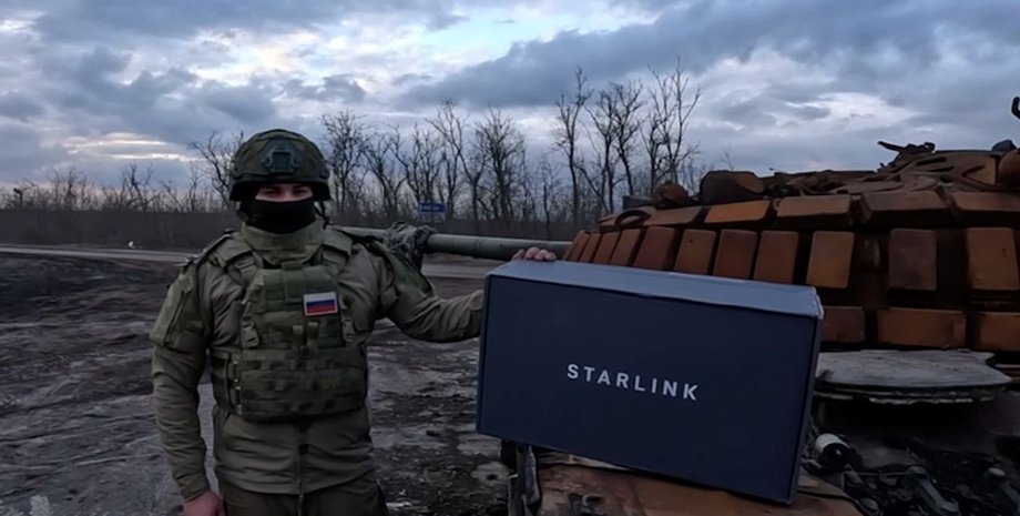 A masked Russian soldier posing with a Starlink box. Photo: social media