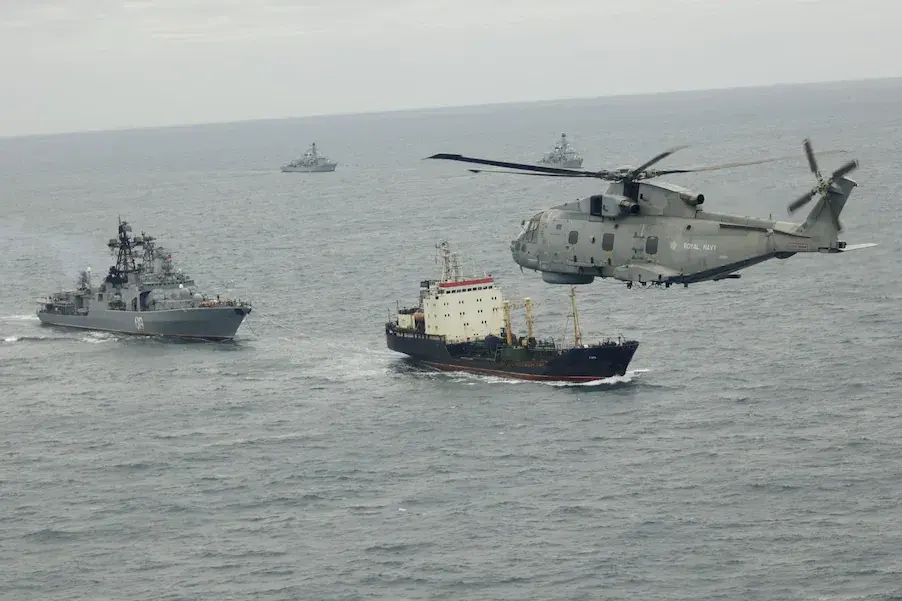HMS Somerset (back right) and HMS St Albans (back left) with a Merlin helicopter track the Russian destroyer Severomorsk and tanker Kama in the Channel. Photo: UK Ministry of Defence